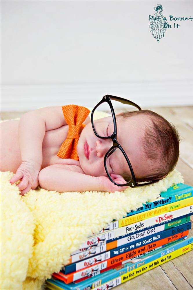 Capturing the baby during tummy time with books.